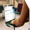 Person choosing a website category on a laptop featuring a Wix's website builder interface.