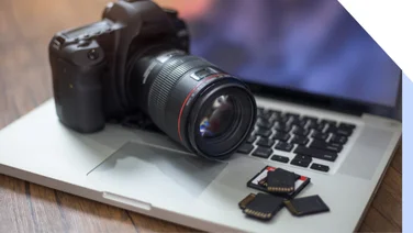 Camera resting on a laptop