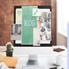 Photo of a desktop with blog graphics on the screen