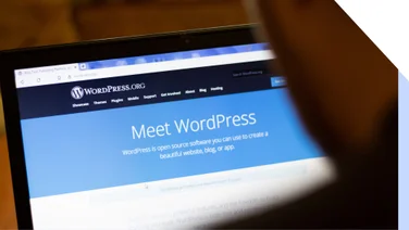 Laptop screen with WordPress.org homepage displayed