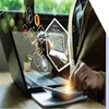 Hands on a desk using a laptop and a calculator