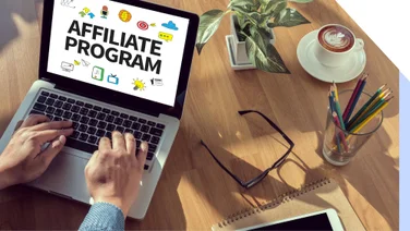 Person types on laptop with Affiliate Program on screen