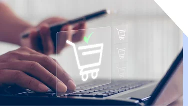 shopping cart icon over laptop