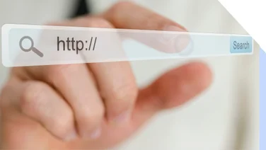 Person pointing at a URL search bar