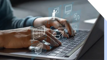 Person types on laptop keypad with graphics floating above