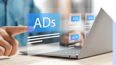 laptop with the word ad popping out from the screen