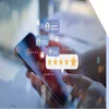 Floating images of reviews and star ratings above a mobile phone