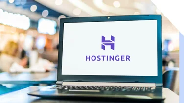 Laptop showing a white screen with Hostinger's logo in the centre