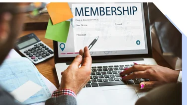 Professional signing up for a membership on a website using a laptop