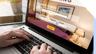 Person browses a hotel booking site on their laptop