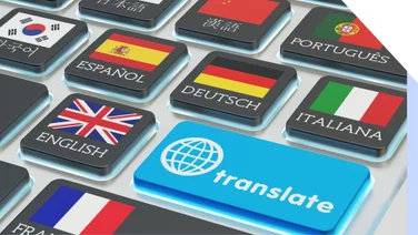 Laptop keyboard with a button to "translate" and keys featuring flags/languages