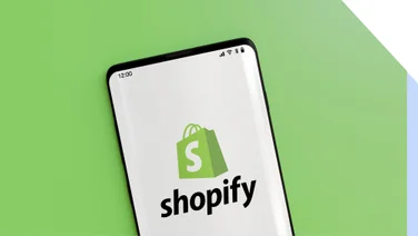 Green background with a phone showing the shopify logo