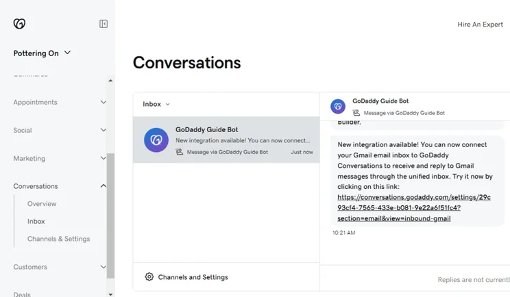 GoDaddy Conversations dashboard showing the unified inbox with a message from GoDaddy Guide Bot