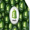 Green and white balls with Shopify logo on them