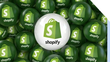 Green and white balls with Shopify logo on them