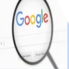 Magnifying glass hovering over the Google homepage