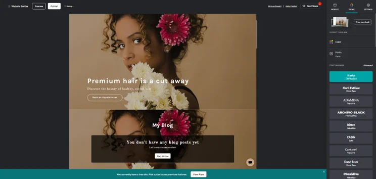 A screenshot showing a website design in GoDaddy editor with a floral hair salon theme
