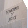 Wall with "Department of Justice" displayed on the side
