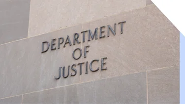 Wall with "Department of Justice" displayed on the side