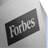 White piece of paper with the Forbes logo printed on it