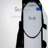 Photo of a desktop and phone with the google chrome browser on screen and a magnifying glass