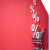 Photo of a cart with percentage signs coming out of it