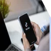 Hands holding a mobile showing the TikTok logo on the screen