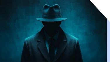 Silhouette of a man in a black fedora hat and suit