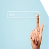 hand pointing to a search bar on a blue background