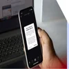 A hand holding a smartphone with a message from TikTok on the screen about the ban