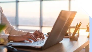 photo of hands typing on a keyboard