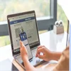 Facebook log in page on laptop and mobile