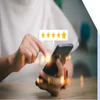 Person using a phone with a floating image above showing a five star rating