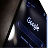 Closeup of Google search on a phone in dark mode