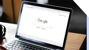 Laptop screen showing Google search homepage