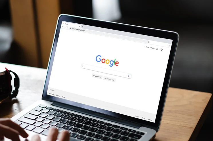 Laptop screen showing Google search homepage