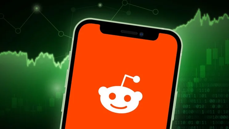 A phone with the Reddit logo on screen