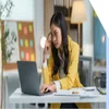 Woman looking puzzled and frustrated as she looks at a laptop