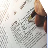 Person filling out a US tax form