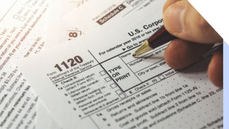 Person filling out a US tax form