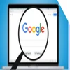 Magnifying glass hovering over a laptop screen showing the Google search homepage