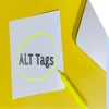 white paper with the words "alt tags" highlighted in yellow marker