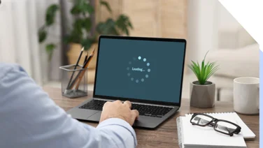 Laptop screen showing a loading icon