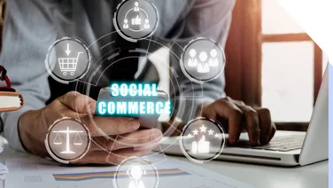Person hand using smart phone with social commerce icon on virtual screen background