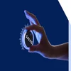 woman's hand cracking up a dial that says "Sales" on it