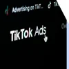 Close up of tiktok ads logo on digital screen