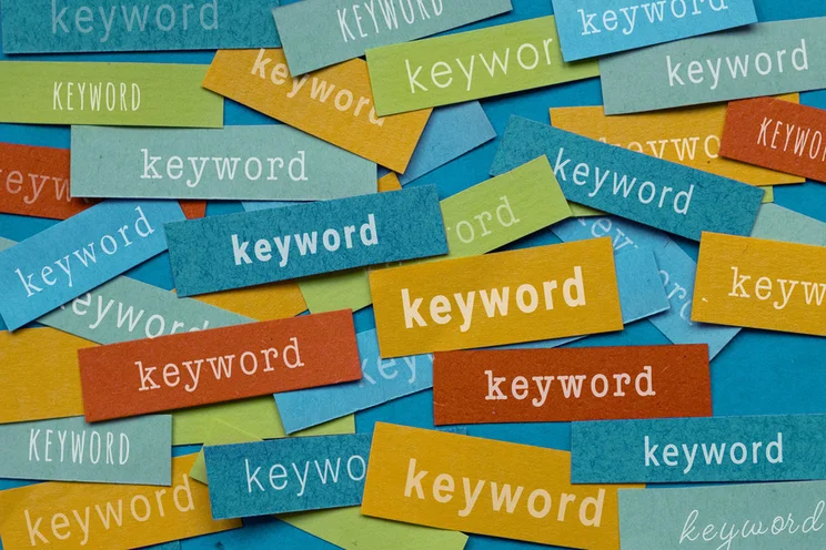 Snippets of colored paper with the word "keyword" written on them