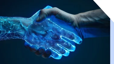 Human hand shaking a glowing blue hand to symbolize technology and AI