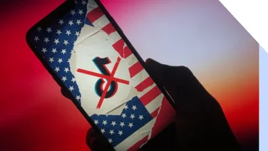 Phone screen showing a collage with the TikTok logo placed on top of the American flag and there's a red cross through the logo