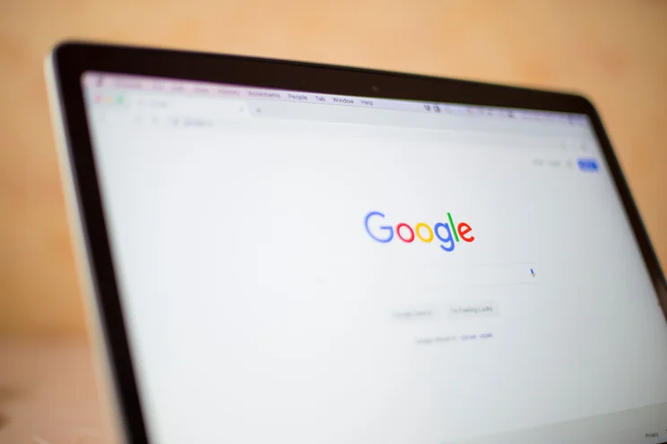 Laptop screen showing Google homepage